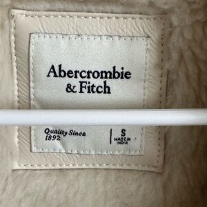 Size Small cream colored Abercrombie leather jacket.